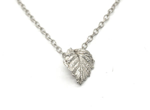 Simple silver necklace with silver leaf