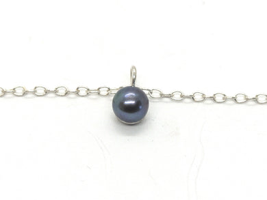 Silver bracelet with blue pearl pendant