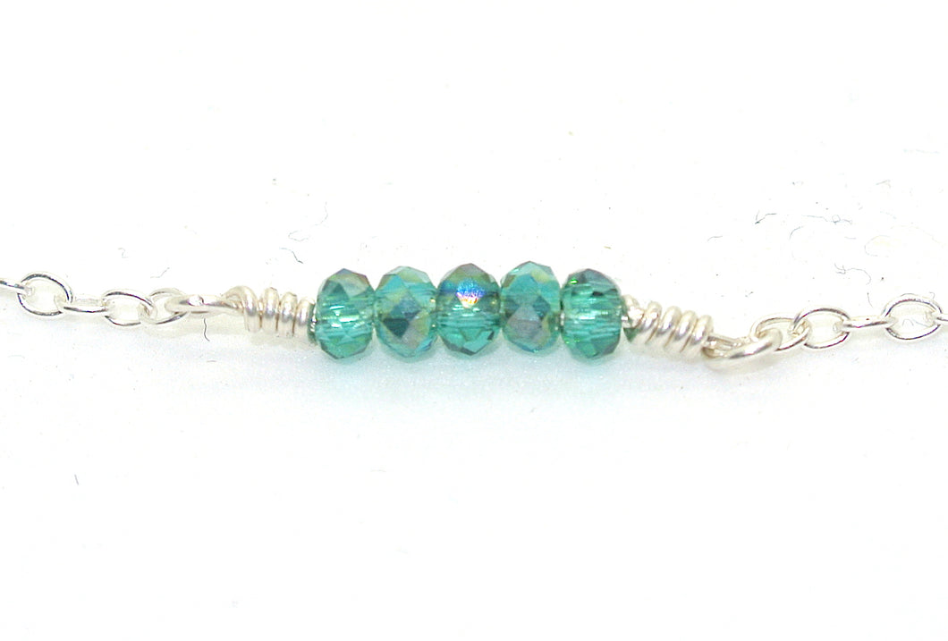 Simple bracelet with blue-green beads
