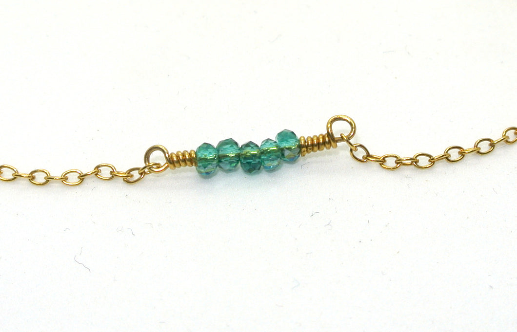 Simple gold-plated bracelet with teal pearls
