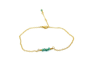 Simple gold-plated bracelet with teal pearls