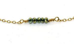 Simple gold-plated bracelet with dark green pearls